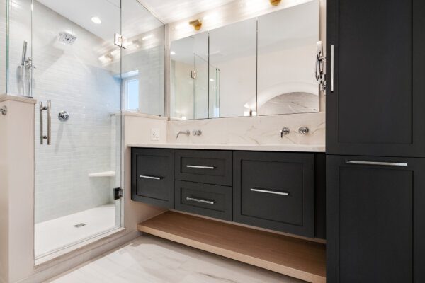 Dark cabinets give drama to an updated master bath in downtown Boulder.