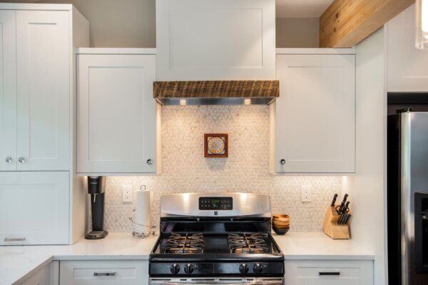 Triangle shaped backsplash with a gas range and appliance garage by SoBo Homes in Boulder