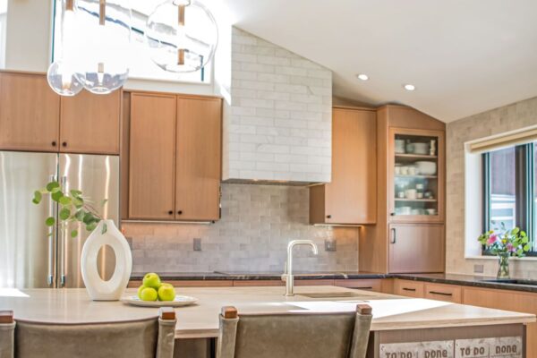 This new kitchen renovation featured an island with a wet bar prep sink.